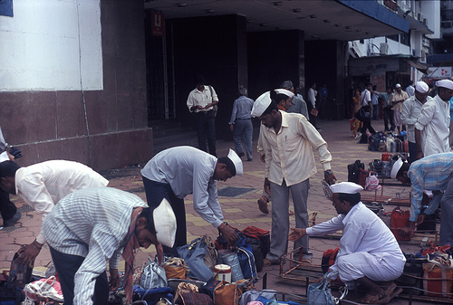 Indian dabbawalas delivering